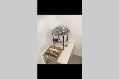 a shelf with a bunch of pastries on it at Beautiful apart Agdal in Rabat