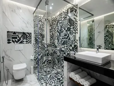 a bathroom with a toilet and a sink and a mirror at BH Appart Hotel in Casablanca