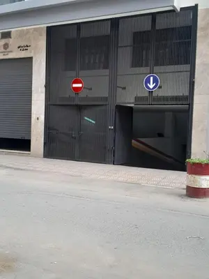 a building with two parking signs on the side of it at Derb Omar,Tram (L1,L2,L3),Parking and wifi gratuit in Casablanca