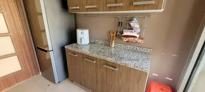 a small kitchen with a counter and a counter top at Apartment Close to Casablanca Mohamed V Airport in Nouaseur
