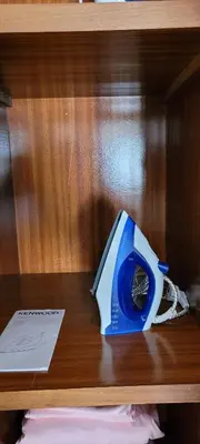 a wooden shelf with a blue item on it at Apartment Close to Casablanca Mohamed V Airport in Nouaseur