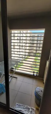 a bathroom with a toilet and a large window at Apartment Close to Casablanca Mohamed V Airport in Nouaseur