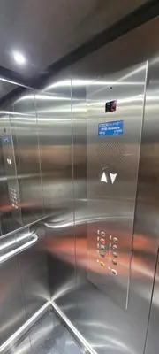 a stainless steel elevator with a sign on it at Apartment Close to Casablanca Mohamed V Airport in Nouaseur