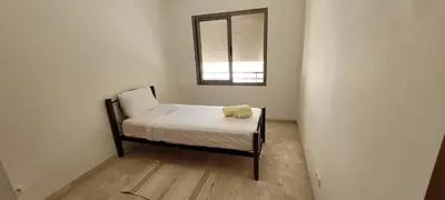 a small bed in a room with a window at Apartment Close to Casablanca Mohamed V Airport in Nouaseur