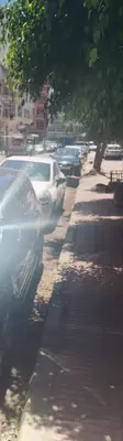 a car parked on the side of a street at Housse coral famille in Casablanca