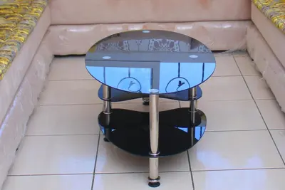 a glass table sitting on top of a tile floor at Mohammedia vive les vacances in Mohammedia