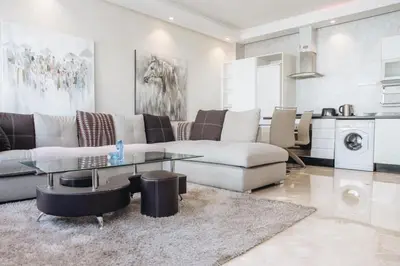 a living room with a couch and a table at STUDIO HAUT STANDING A RACINE near twin center in Casablanca
