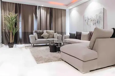 a living room with couches and chairs and a table at STUDIO HAUT STANDING A RACINE near twin center in Casablanca