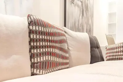 a group of pillows on a bed in a room at STUDIO HAUT STANDING A RACINE near twin center in Casablanca