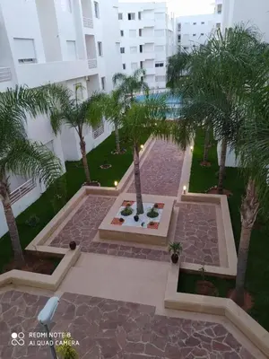 an aerial view of a courtyard with palm trees at BOUZNIKA T2 in Bouznika