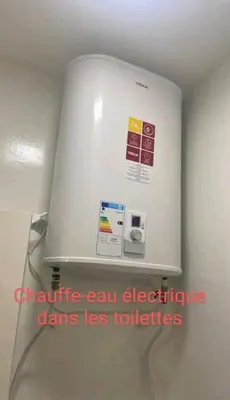 a white refrigerator in a room with signs on it at Appartement RIM in Casablanca