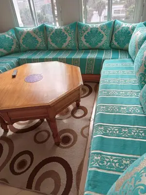 a living room with a couch and a coffee table at Appartement près de casanearshore et l'OFPPT in Casablanca