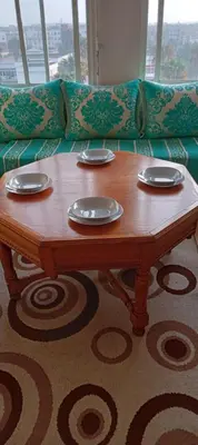 a wooden coffee table in front of a couch at Appartement près de casanearshore et l'OFPPT in Casablanca
