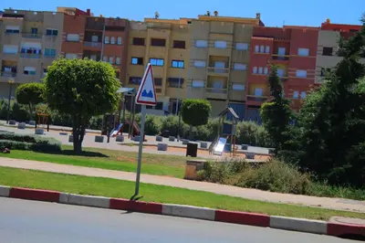 a street sign on the side of a road at Le chant de la rivière BOUZNIKA in Bouznika