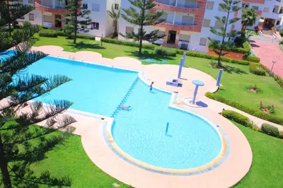 an overhead view of a swimming pool in a resort at Les temps heureux MOHAMMEDIA in Mohammedia