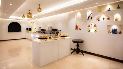 a kitchen with a counter with bowls of food on it at Hotel Al Walid in Casablanca
