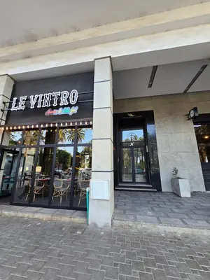 a restaurant with a sign that reads he winteroco at Joli appartement Mohammédia in Mohammedia