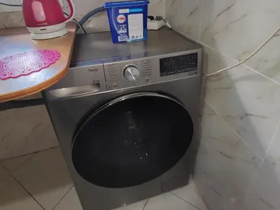 a washing machine sitting in a kitchen next to a counter at Spacious 2BR Ground-Floor Apartment Parking & Free Wi-Fi in Casablanca