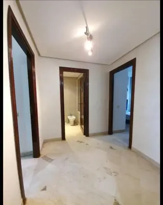 an empty hallway with a toilet in a room at Résidence jnane California in Casablanca