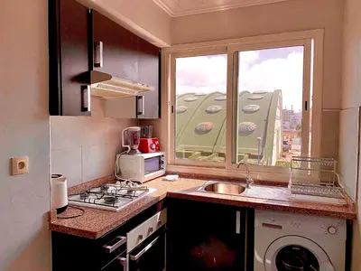 a kitchen with a sink and a window at Sab 8 - Amazing view. 2 bedrooms in front of the mosque Hassan. Perfect location in Casablanca