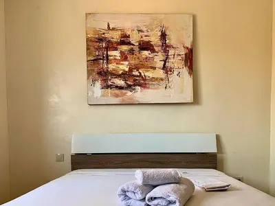 a bedroom with a bed with two towels on it at Sab 8 - Amazing view. 2 bedrooms in front of the mosque Hassan. Perfect location in Casablanca