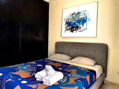 a bedroom with a bed with two towels on it at Sab 8 - Amazing view. 2 bedrooms in front of the mosque Hassan. Perfect location in Casablanca