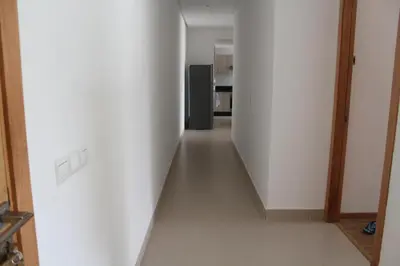 an empty hallway with a refrigerator in a kitchen at MOHAMMEDIA Paradise Beach in Mohammedia