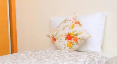two pillows sitting on top of a bed at MOHAMMEDIA Paradise Beach in Mohammedia