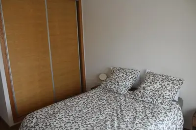 a bedroom with a bed and a closet at Paradise BEACH in Mohammedia