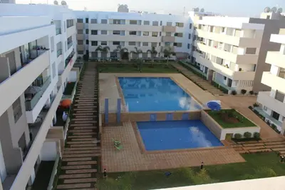 an overhead view of a swimming pool between two buildings at Paradise BEACH in Mohammedia