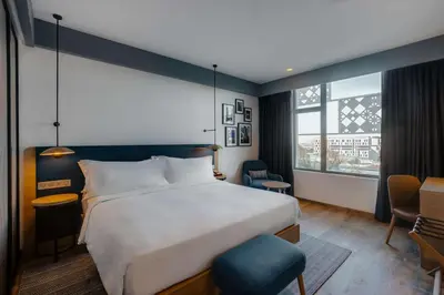 a hotel room with a large bed and a window at Hilton Garden Inn Casablanca Sud in Casablanca