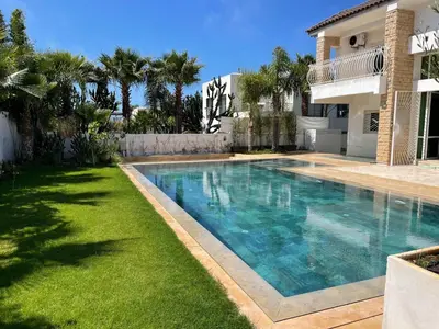 a swimming pool in the yard of a house at Skhirat VILLA Zhor in Skhirat