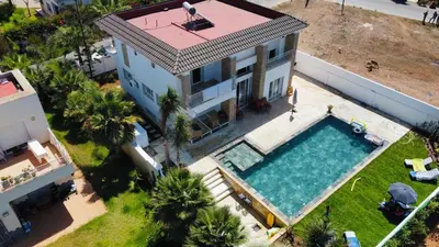 an aerial view of a house with a swimming pool at Skhirat VILLA Zhor in Skhirat