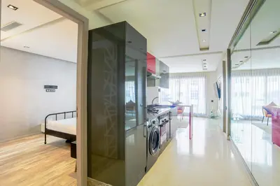 a kitchen with a washer and dryer in a room at Tantan golden 5 not far from beach in Casablanca