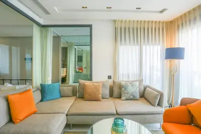 a living room with a couch and a table at Tantan golden 5 not far from beach in Casablanca