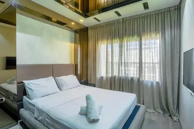 a bedroom with a bed with two towels on it at Massira Diamond Maarif- Parking-wifi-self check in in Casablanca