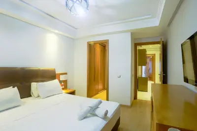 a bedroom with a bed with two towels on it at Racine spacious 2 bedrooms near twin center#Freewifi#freeparking in Casablanca