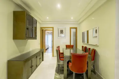 a kitchen and dining room with a table and chairs at Racine spacious 2 bedrooms near twin center#Freewifi#freeparking in Casablanca