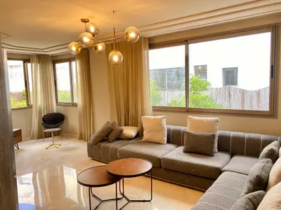 a living room with a couch and a table at #26 Maarif urban Massira near twin center casablanca in Casablanca
