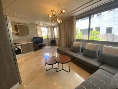 a living room with a couch and a table at #26 Maarif urban Massira near twin center casablanca in Casablanca