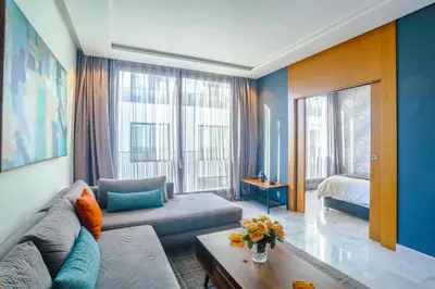 a living room with a couch and a bed at Lavish Flat in new city #fastwifi#Parking in Casablanca
