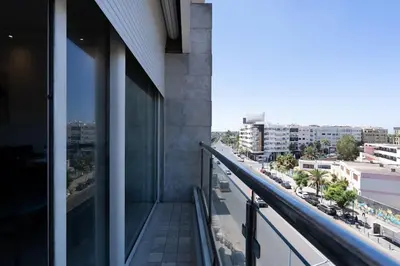 a balcony of a building with a view of a city at Racine bd anfa Appart style tokyo near twin center in Casablanca
