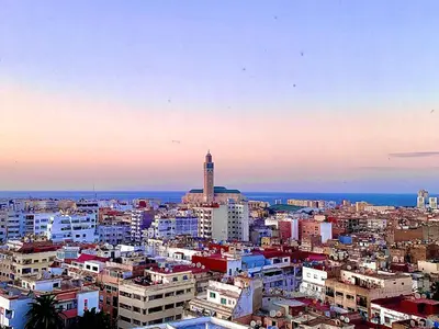 a city skyline with a clock tower in the distance at Anfa 118 - Best view in town - 3 bedrooms - 2 Bathrooms in Casablanca