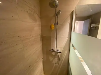 a shower with a shower head in a bathroom at Très beau studio à Ain Diab in Casablanca