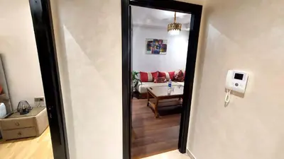 a view of a living room from a hallway at luxury apartment opposite HASSAN 2 MOSQU and FAIR international casablanca and SEA , near downtwn , INTERDIT COUPLES ARAABIC NON MARIÈ, FORBIDDEN UNMARRIED ARAABIC COUPLES , 2 room, 2 living rooms and 2 bathrooms basement car park FREE , apartment with in Casablanca