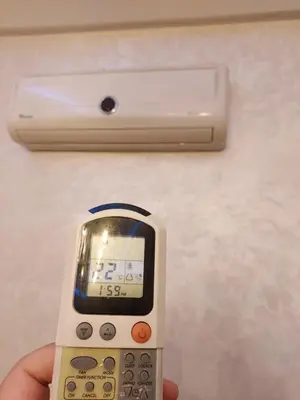 a person holding a cell phone with a clock on it at luxury apartment opposite HASSAN 2 MOSQU and FAIR international casablanca and SEA , near downtwn , INTERDIT COUPLES ARAABIC NON MARIÈ, FORBIDDEN UNMARRIED ARAABIC COUPLES , 2 room, 2 living rooms and 2 bathrooms basement car park FREE , apartment with in Casablanca