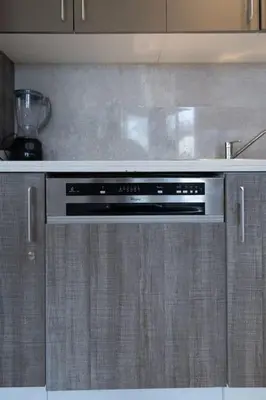 a kitchen with a stove top oven in a kitchen at #56 Maarif Racine urban Massira near twin center in Casablanca