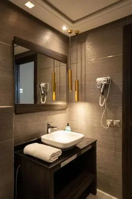 a bathroom with a sink and a mirror at #56 Maarif Racine urban Massira near twin center in Casablanca