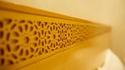 a close up of a wooden object with a pattern on it at Hotel de paris in Casablanca