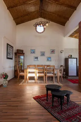 a dining room with a table and a tableasteryasteryasteryasteryasteryasteryastery at Dar Ghita en campagne in O Ben Slimane